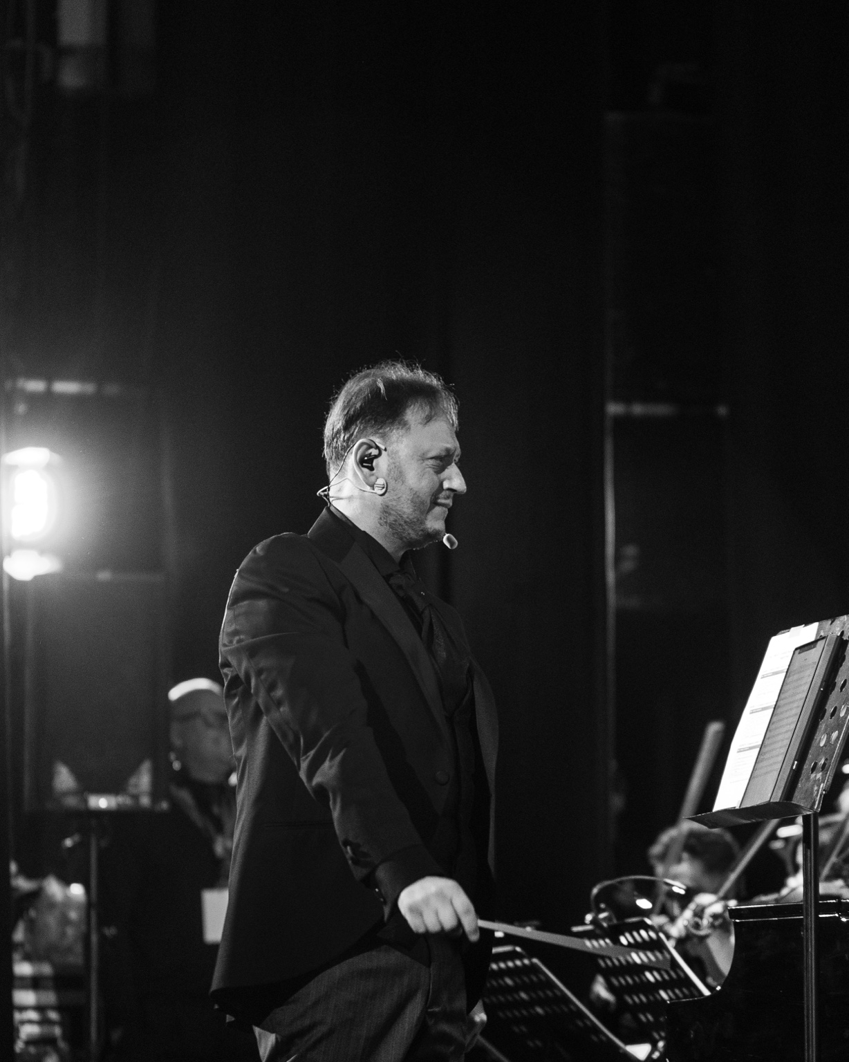 Black-and-white portrait of Vincenzo Sorrentino on the podium